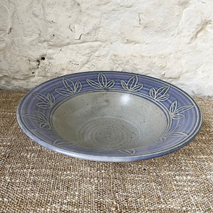 Thrown Brewery Pottery bowl with a blue hand carved  pattern. Using a handmade bowl is a great way to enjoy and enhance your favorite meals. Whether you're eating alone or serving a friends, using handmade ceramic bowl is a lovely way to showcase your beautifully prepared meal.