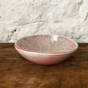 This small porcelain copper red Brewery Pottery bowl is handmade from a slab of clay textured with vintage lace. When in the kitchen, we love and use these little catch all ceramics bowls for salsas, dips, hummus, ice cream, small snacks, and even those tiny leftovers.
