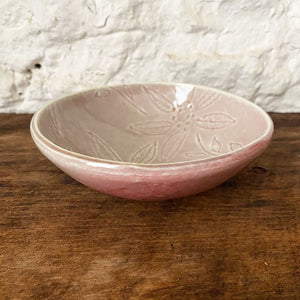This small porcelain copper red Brewery Pottery bowl is handmade from a slab of clay textured with vintage lace. When in the kitchen, we love and use these little catch all ceramics bowls for salsas, dips, hummus, ice cream, small snacks, and even those tiny leftovers.
