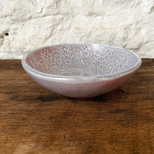  This small porcelain reddish blue  Brewery Pottery bowl is handmade from a slab of clay textured with vintage lace. When in the kitchen, we love and use these little catch all ceramics bowls for salsas, dips, hummus, ice cream, small snacks, and even those tiny leftovers.