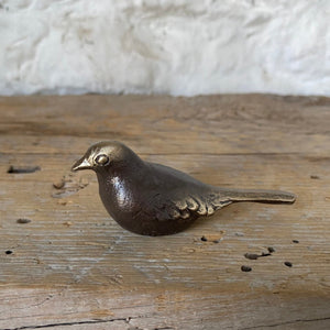 This small bronze bird is a perfect accent for your desk, bookshelf or tabletop. The artist created this bird sculpture in his foundry where he sand casts then finishes each piece to create an object beauty, strength and whimsy.