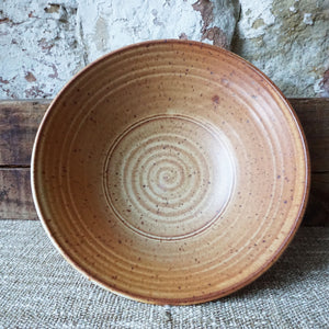 Rust colored thrown Brewery Pottery bowl. Using a handmade bowl is a great way to enjoy and enhance your favorite meals. Whether you're eating alone or serving a friends, using handmade ceramic bowl is a lovely way to showcase your beautifully prepared meal.