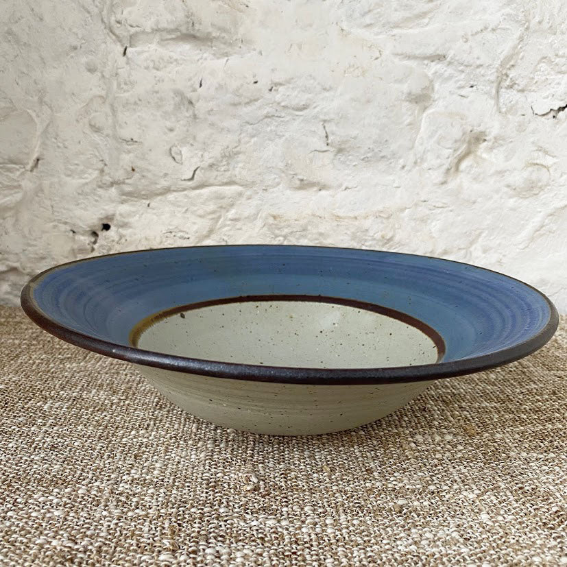 Blue rimmed thrown Brewery Pottery bowl. Using a handmade bowl is a great way to enjoy and enhance your favorite meals. Whether you're eating alone or serving a friends, using handmade ceramic bowl is a lovely way to showcase your beautifully prepared meal.